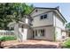 Spacious backyard featuring a patio and stairs leading to a deck and lush greenery at 4821 W 102Nd Ave, Westminster, CO 80031