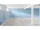 Spacious unfinished basement with blue walls, carpet flooring, and support beams at 4821 W 102Nd Ave, Westminster, CO 80031