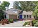 Charming home featuring a blue front door, attached two-car garage, and well-manicured landscaping with beautiful foliage at 4821 W 102Nd Ave, Westminster, CO 80031