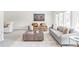 Bright and airy living room featuring comfortable seating, a large coffee table and an eye-catching art piece at 4821 W 102Nd Ave, Westminster, CO 80031