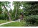 A quaint bridge over a creek on a walking path surrounded by a lush landscape with mature trees at 4821 W 102Nd Ave, Westminster, CO 80031