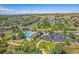 Aerial view of neighborhood amenities including community pool, playgrounds, and parking at 23298 Barnsley Ln, Parker, CO 80138