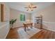 Bright bedroom with a ceiling fan, window with green view, and neutral decor at 23298 Barnsley Ln, Parker, CO 80138