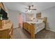 Comfortable bedroom featuring a ceiling fan, cozy furniture, and soft lighting for a relaxing and inviting atmosphere at 23298 Barnsley Ln, Parker, CO 80138