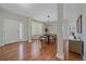 Dining room featuring hardwood floors, light fixture, and large window at 23298 Barnsley Ln, Parker, CO 80138