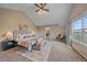 A spacious main bedroom boasts vaulted ceilings, and plush carpeting, creating a serene and inviting retreat at 23298 Barnsley Ln, Parker, CO 80138