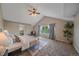 A spacious main bedroom features vaulted ceilings, and ample natural light, complemented by plush carpeting at 23298 Barnsley Ln, Parker, CO 80138