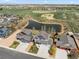 A neighborhood aerial view includes homes, a pond, green space and other neighborhood amenities at 2757 Stallion Way, Mead, CO 80542