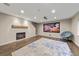 Finished basement featuring fireplace, movie screen and comfortable chair at 2757 Stallion Way, Mead, CO 80542