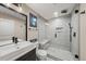 Modern bathroom featuring a glass-enclosed shower with bench at 2757 Stallion Way, Mead, CO 80542