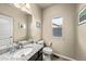 This bathroom features a granite countertop, sleek fixtures, and light-colored walls at 2757 Stallion Way, Mead, CO 80542
