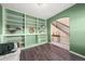 Home office with custom built-in shelving and hardwood floors at 2757 Stallion Way, Mead, CO 80542