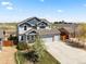 Beautiful two-story home boasting a large driveway, manicured lawn, and attractive facade at 2757 Stallion Way, Mead, CO 80542