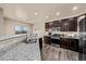 Modern kitchen features granite countertops, stainless steel appliances, and ample cabinet space at 2757 Stallion Way, Mead, CO 80542