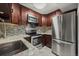 Kitchen featuring stainless steel appliances, granite countertops and mosaic tile backsplash at 3050 W 32Nd Ave # 104C, Denver, CO 80211