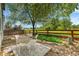 Backyard featuring a patio, greenery, a wooded fence, and a beautiful view at 4267 W Kenyon Ave, Denver, CO 80236