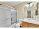 Bathroom featuring a shower-tub combo and a vanity with a sink at 4267 W Kenyon Ave, Denver, CO 80236