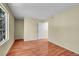 Bedroom features wood floors, window with a view, and neutral paint at 4267 W Kenyon Ave, Denver, CO 80236