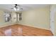 Spacious bedroom with wood floors and a ceiling fan offers natural light from the windows at 4267 W Kenyon Ave, Denver, CO 80236