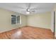 Bedroom with wood floors, ceiling fan, and a sun-filled window at 4267 W Kenyon Ave, Denver, CO 80236