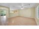 The living room is an open space with hardwood floors and large windows creating a light and airy atmosphere at 4267 W Kenyon Ave, Denver, CO 80236