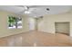 Living room with hardwood floors and modern lighting, offering a welcoming and stylish space for relaxation and entertainment at 4267 W Kenyon Ave, Denver, CO 80236
