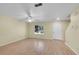 Bright and open living room features hardwood floors, a ceiling fan, and abundant natural light from the window at 4267 W Kenyon Ave, Denver, CO 80236