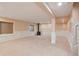 Finished basement with a wood burning stove, plush carpet, and decorative paneling at 5740 S Tempe Ct, Aurora, CO 80015