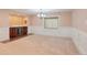 Basement bar area featuring cabinetry, counter tops, and beverage refrigerator at 5740 S Tempe Ct, Aurora, CO 80015