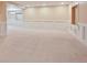 Finished basement with plush carpeting and decorative paneling at 5740 S Tempe Ct, Aurora, CO 80015
