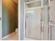 A tiled walk-in shower with glass door is in a well-lit bathroom at 5740 S Tempe Ct, Aurora, CO 80015