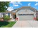 Charming single-Gathering home with a well-maintained lawn and an attached two-car garage at 5740 S Tempe Ct, Aurora, CO 80015