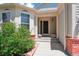 A welcoming front porch with flowers creates a cozy entrance to this single Gathering home at 5740 S Tempe Ct, Aurora, CO 80015