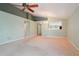 Large living room with vaulted ceilings and an open concept feel with a view to the eat in kitchen at 5740 S Tempe Ct, Aurora, CO 80015