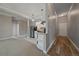 Bright and spacious entryway with wood-look flooring and views into the kitchen and living areas at 3233 Vallejo St # 3B, Denver, CO 80211