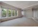 Spacious living room with large windows and neutral carpeting at 3233 Vallejo St # 3B, Denver, CO 80211