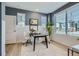 Bright home office featuring natural light, modern decor, stylish desk, and comfortable seating at 1751 Peak Loop, Broomfield, CO 80023