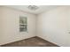 Simple bedroom with neutral decor and a window with blinds at 16598 E Lasalle Pl, Aurora, CO 80013