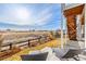 Outdoor patio area with lounge chairs and views of open space at 22773 E Narrowleaf Cir, Aurora, CO 80016