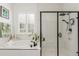 Modern bathroom showcasing a black-framed glass shower and separate soaking tub at 22773 E Narrowleaf Cir, Aurora, CO 80016