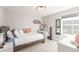 Bedroom featuring a rustic wood bed frame, neutral decor and vanity at 22773 E Narrowleaf Cir, Aurora, CO 80016