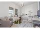 Cozy Bedroom with a neutral color scheme, featuring a crib, dresser, and a comfortable armchair at 22773 E Narrowleaf Cir, Aurora, CO 80016