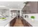 Well-designed kitchen with stainless steel appliances, quartz countertops, and open floor plan view at 22773 E Narrowleaf Cir, Aurora, CO 80016