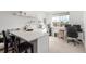 Bright kitchenette with white countertops, a black sink, and stainless steel appliances, creating a functional workspace at 22773 E Narrowleaf Cir, Aurora, CO 80016