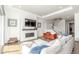 Cozy living room featuring hardwood floors and a modern fireplace at 22773 E Narrowleaf Cir, Aurora, CO 80016