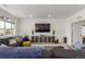 Comfortable living room featuring a large sectional sofa, entertainment center, and a cozy atmosphere at 22773 E Narrowleaf Cir, Aurora, CO 80016