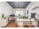 Spacious home office featuring dual desks, modern lighting, and hardwood floors at 22773 E Narrowleaf Cir, Aurora, CO 80016