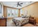 Cozy bedroom with ceiling fan, shuttered windows, and a comfortable bed at 8717 Ridgepoint Dr, Castle Pines, CO 80108