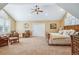 Expansive bedroom featuring ample seating, vaulted ceilings, and lots of natural light at 8717 Ridgepoint Dr, Castle Pines, CO 80108