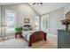 Comfortable bedroom features vaulted ceilings, large windows, and a cozy bed for a relaxing retreat at 8717 Ridgepoint Dr, Castle Pines, CO 80108